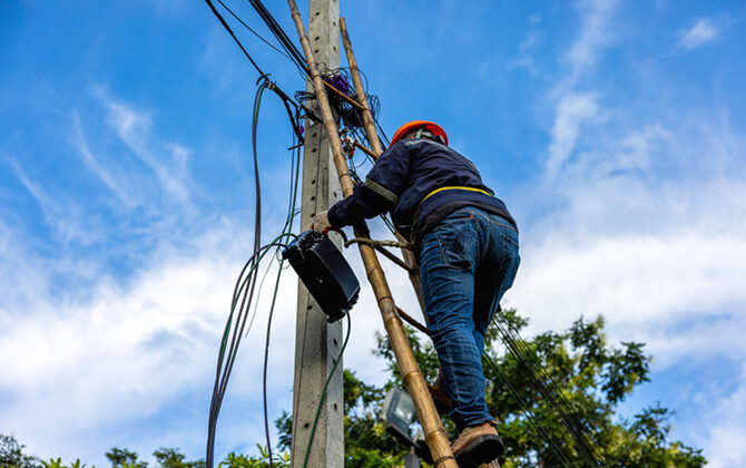 a-telecoms-worker-is-shown-working-from-a-utility-2022-09-27-23-11-27-utc